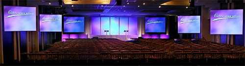 Set with two repeater screens at each side of the room due to the low ceiling.